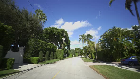 Driving through upscale luxury neighborhoods in Miami Beach FL