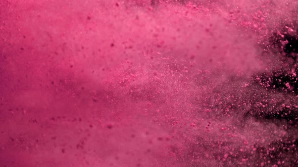 Super Slowmotion Shot of Side Pink Powder Explosion Isolated on Black Background at 1000Fps