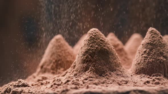 Cocoa powder falling on luxury homemade truffle candies