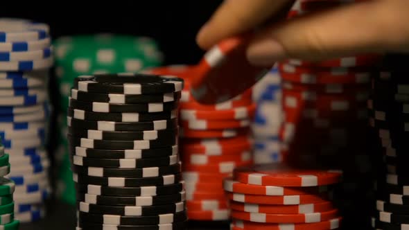 Lady Rotating Poker Chip in Hand, Pondering on Strategy of Game, Fortune Sign