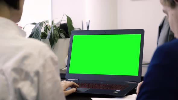 Workers On Laptop With Green Screen