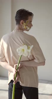 Handsome Young Man with Flowers on Face