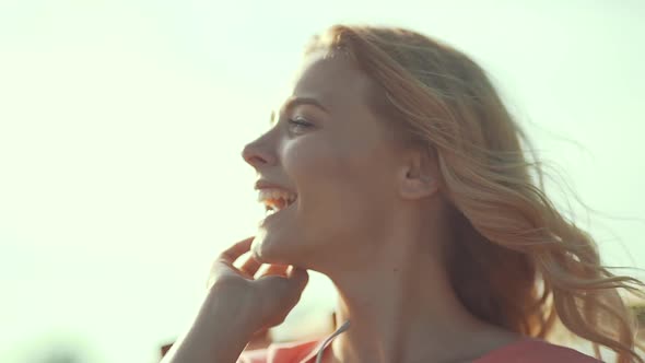 Beautiful Smiling Girl Enjoying Summer Sun. Happy Woman Having Fun On Wind