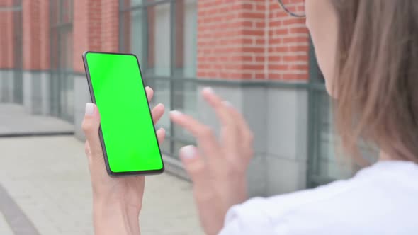 Walking Woman Using Smartphone with Green Screen