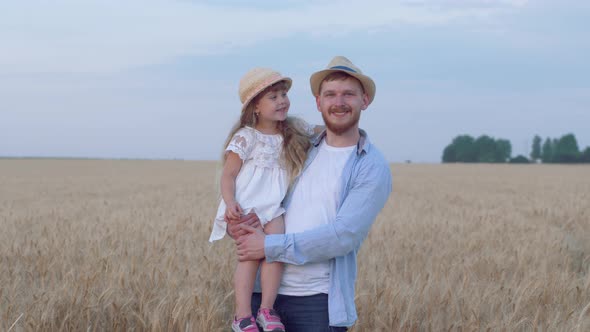 Portrait of Happy Father and Daughter, Cheerful Daddy Stays with Merry Smiling Child Girl on His