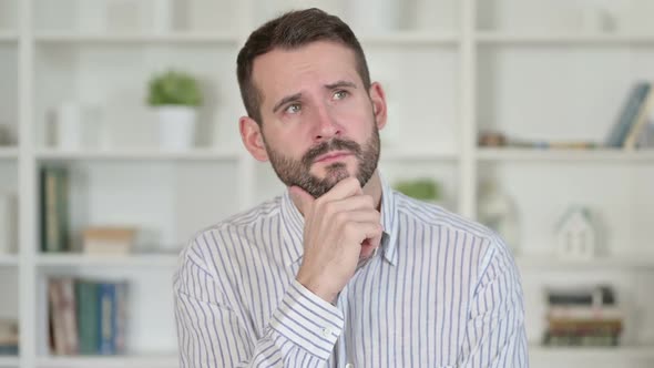 Portrait of Thoughtful Young Man Thinking