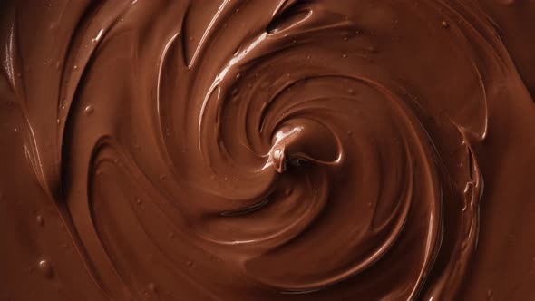 melted premium dark chocolate top view rotating