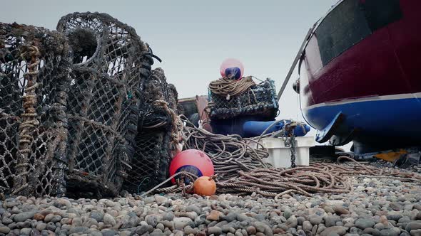 Lobster Pots By Boat On The Shore