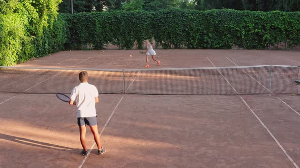 Aerial View of Two Tennis Players Practise Game Before Competition