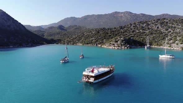 Stunning Aerial View of the Bright Blue Waters of the Bay of the Volcanic Island of Suluada and