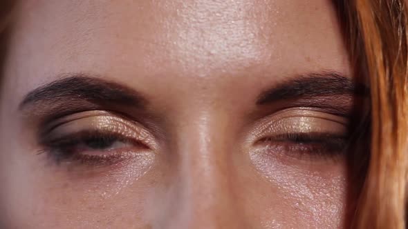 Close Up Shot of the Eyes of a Woman Who Are Painted with Mascara and Shadows