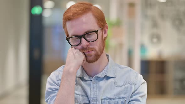 Portrait of Tired Casual Redhead Man Taking Nap