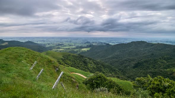 Grey Clouds Moving over Green Landscape in Cloudy Morning in New Zealand Wild Nature