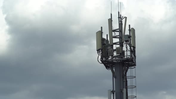 mobile communications tower against the sky. time lapse