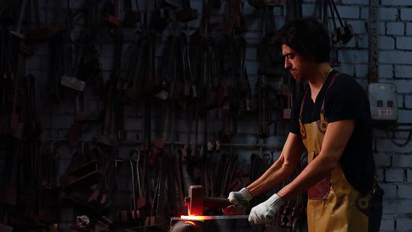 Slowmotion Shoot of Authentic Handsome Indian Man in Leathern Apron Hammer Industry Small Business