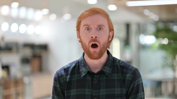 Portrait of Worried Beard Redhead Man Feeling Shocked