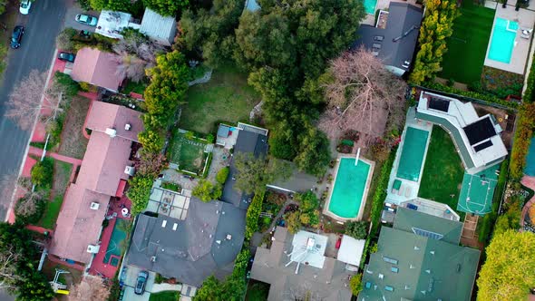 Flying over Los Angeles suburbs. Day, aerial. Birds eye top down view