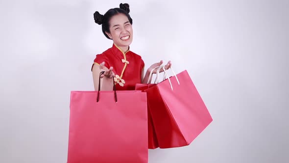 happy woman holding shopping bag on chinese new year celebration