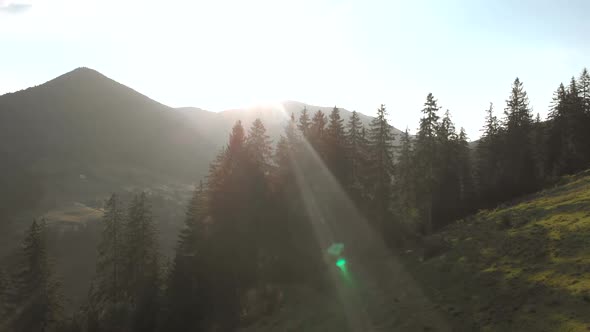 Scenic View of Sun Rays Over Mountain Landscape