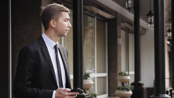 Young Businessman Surprised By the Lack of a Taxi