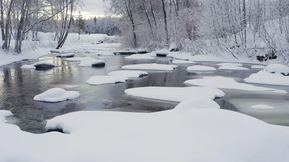 The Frozen Rocks on the River in the Forest in Estonia