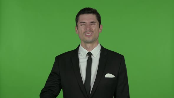 Young Businessman Having Headache, Chroma Key