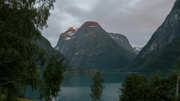 View From Afar Of The Mountain And Lake In Norway - timelapse shot