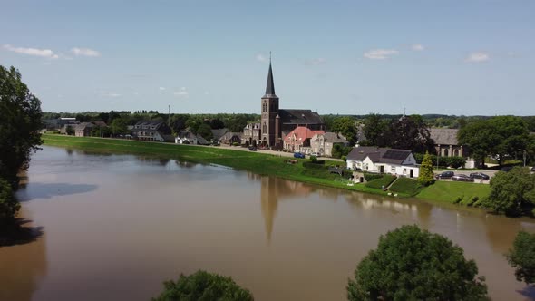 Flooded land and floodplains, drowned trees, river Maas village Appeltern