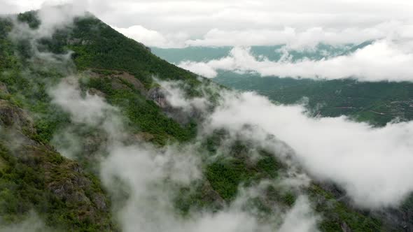 Aerial View Over the Mountain Forest Covered in Fog Untouched Ecosystem in World Beautiful Nature