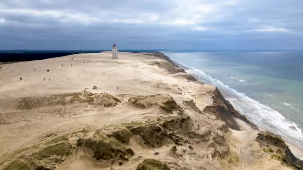 Aerial view of Rubjerg Knude with lighthouse and beautiful coastline by the North Sea, Denmark