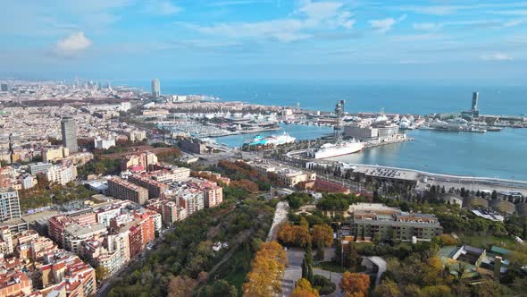 Aerial drone view of Barcelona city sea coastline with port. Sunny day. Montjuic district. Spain