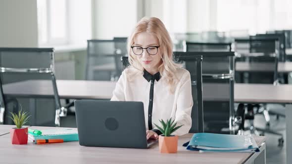 Manager Has Remote Meeting with Colleagues