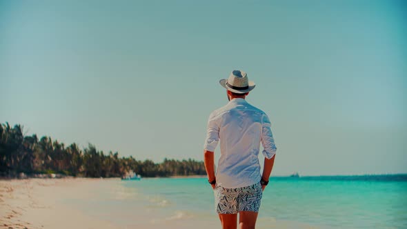 Businessman Relaxation Travel On Beach Vacations. White Sand And Calm Ocean On Seychelles.