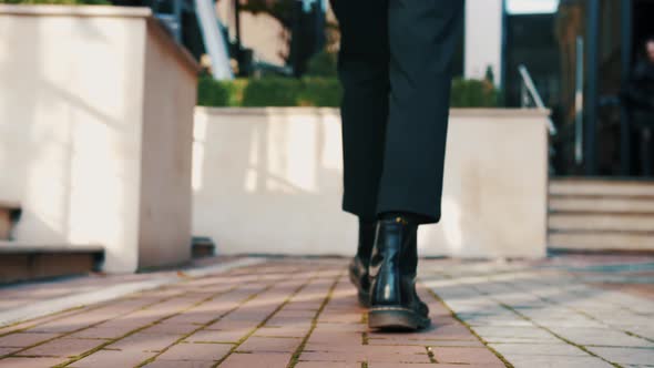 Following the Men's Feet Young Stulish Businessmen Walking Outside Urban City at Low Angle