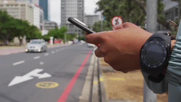 Hands of african american businesswoman using smartphone