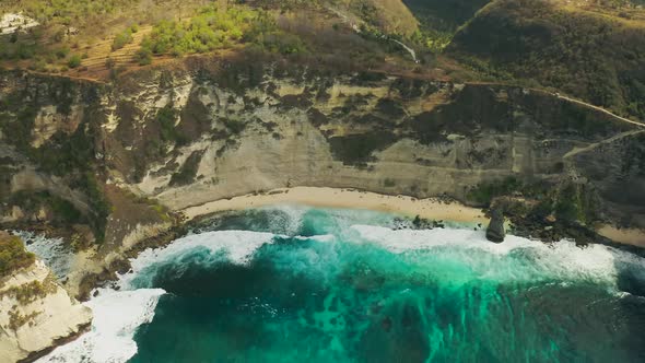 Waves Crashing Onto Diamond Beach in Nusa Penida Island, Bali in Indonesia. Aerial View 