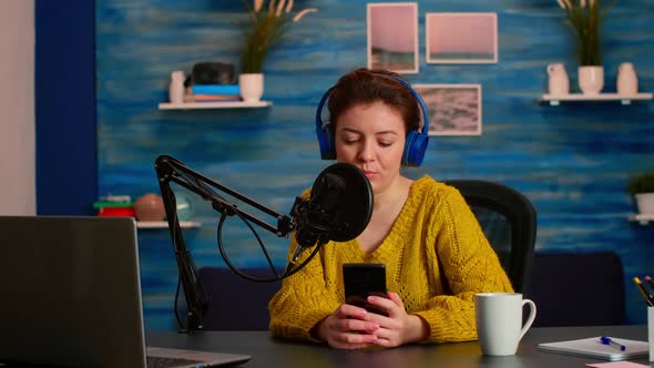 Blogger Woman Recording Video for Her Blog in Home Studio