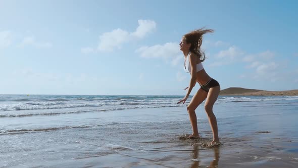 Young Strong Woman in Sportswear Doing Plyometric Exercises on Pier