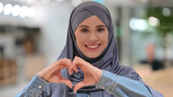 Loving Arab Woman Making Heart Sign By Hand