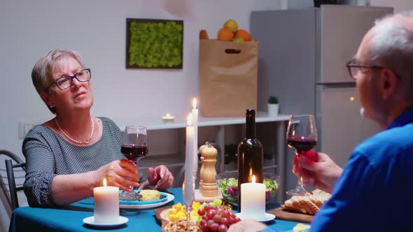 Relaxed Couple Eating Dinner