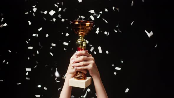 Professional Sportsman Winner Holding Gold Cup Closeup