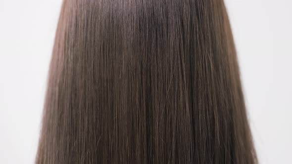 Demonstration of Smooth and Silky Hair After Straightening It with a Steampod