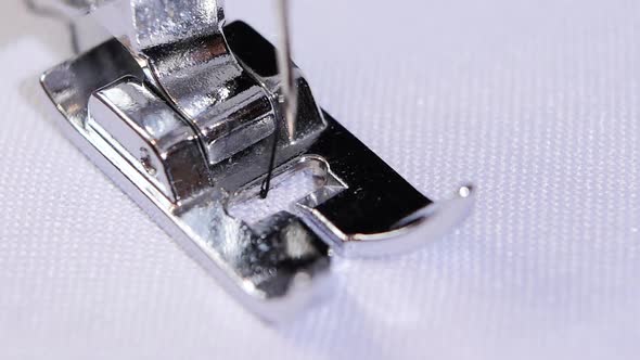 Sewing Machine Sews a Figured Stitch in Slow Motion