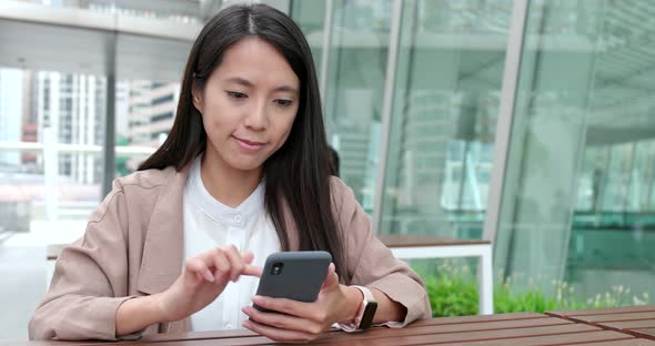 Business woman use of smart phone at coffee shop