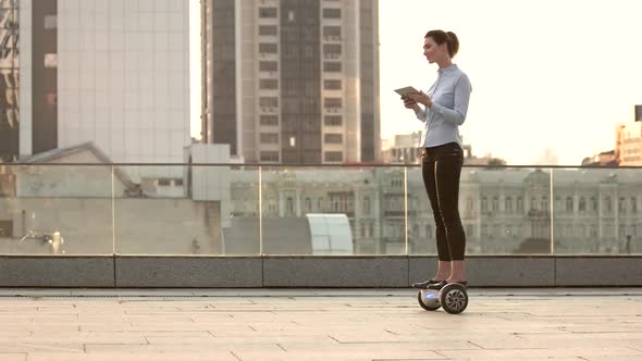 Woman on Hoverboard, Urban Background