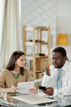 ng consultation to young woman at table