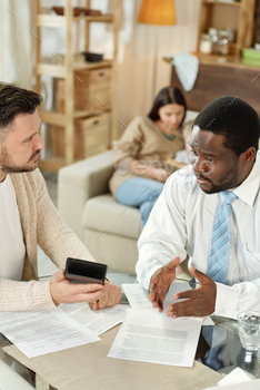 discussing home loan at table indoors