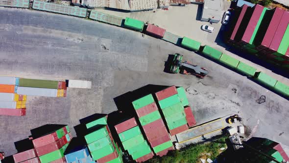 Forklift Truck Lifting Cargo Container in Dock Yard for Transportation Import Export and Logistic