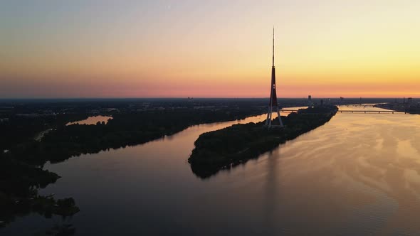 Aerial Flight Towards Radio Tower Over River Daugava