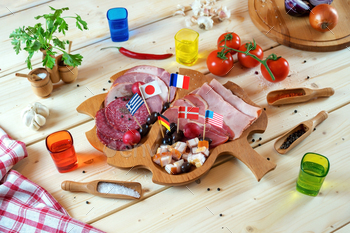 Various Meat Delicacies and Spices on Wooden Table